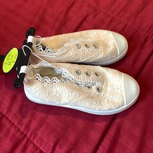 I am selling girls sneakers light cream color size 8